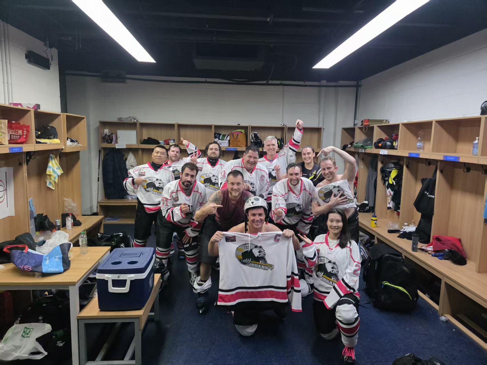 Bears team celebrating together in the locker room