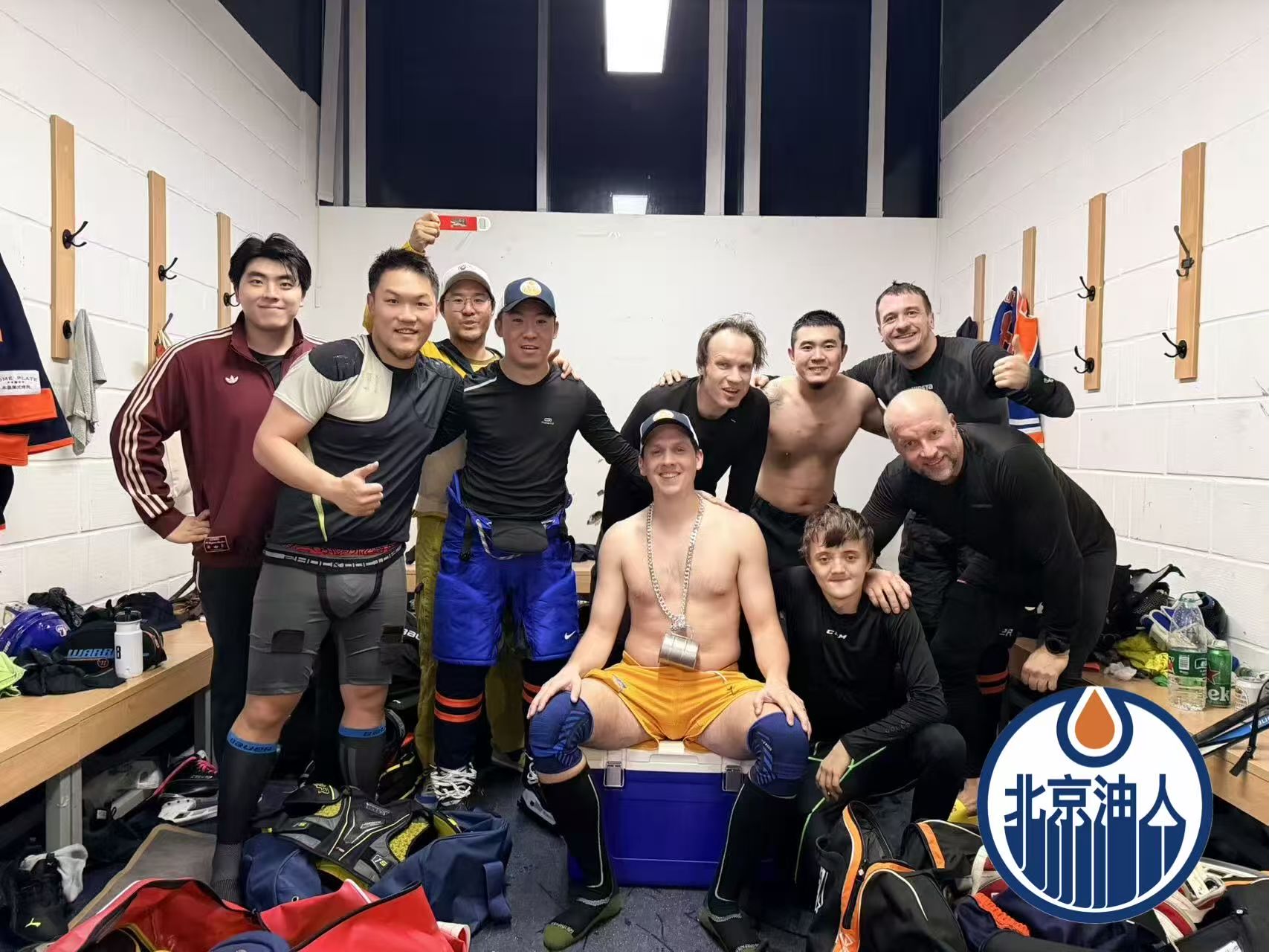 Oilers Week 5 locker-room team photo with the Beijing Oilers logo