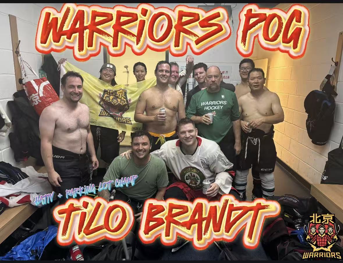 Warriors Week 3 locker-room team photo celebrating their win